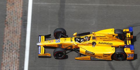 Fernando Alonso piloting his McLaren-Honda-Andretti entry across the yard of bricks at the Indianapolis 500.