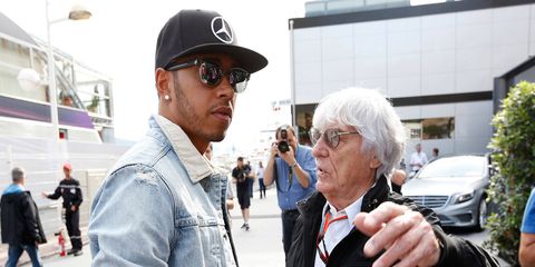 Formula One boss Bernie Ecclestone, left, talks with series champion Lewis Hamilton at Monaco.