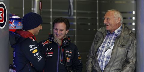 Red Bull billionaire Dietrich Mateschitz, right, talks with Red Bull Racing team principal Christian Horner, center, and driver Daniel Ricciardo during the 2014 season.