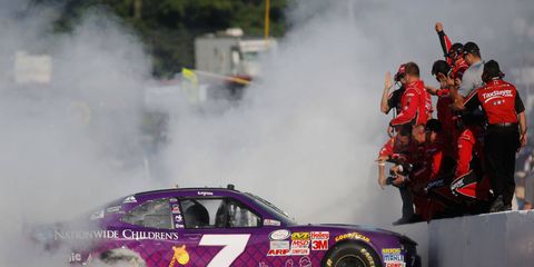 Regan Smith shares the winning moment with his team on Saturday.