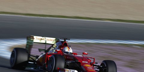 Four-time Formula One champion Sebastian Vettel tries on his Ferrari colors on Sunday in Jerez, Spain.
