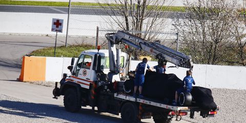 A recovery truck removes the crashed Lance Stroll Williams FW40 Mercedes.