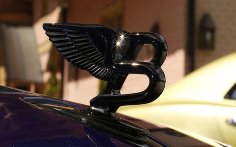 The retractable hood ornament can be had in dark tint, to match the Piano Black wood interior.