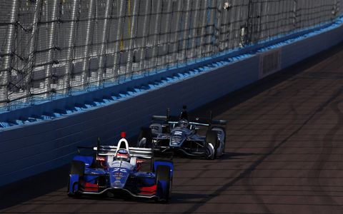 Friday's practice at Phoenix was interrupted by a sandstorm, as later Helio Castroneves shattered the lap record he set a year ago on the 1.022-mile oval in Friday night's qualifying for the Desert Diamond West Valley Phoenix Grand Prix.