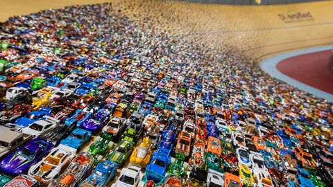 To create our temporary display, we hand-stuck 8,200 Hot Wheels cars to the banked track at the Lexus Velodrome.