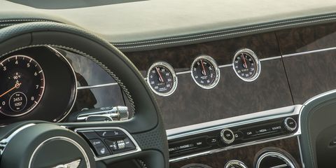 The 2019 Bentley Continental GT Convertible "Bentley Rotating Display" is a three-sided block where the owner can choose between 12.3-inch touchscreen or three analog gauges or, when the car isn't running, a simple block of veneer wood.
