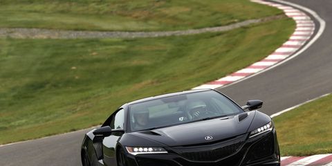 The 2019 Acura NSX in black, lapping its own personal Nurburgring in Northern Japan. It's called The Winding Course.