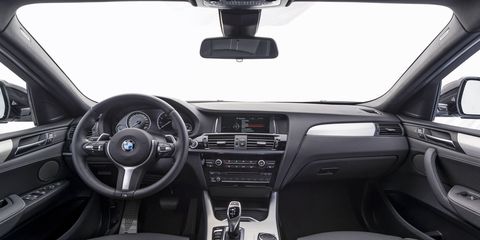 The 2017 BMW X4 M40i's interior looks mostly like a 3-Series with stiff seats and lots of plastic buttons.