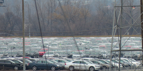 A very dreary photo of doomed Volkswagens in the crumbling parking lot of the Pontiac Silverdome. It doesn't get much bleaker than this.