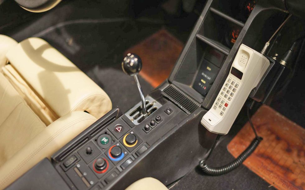 The Testarossa comes with a phone, which you can use to call 1986 to give it some stock tips.