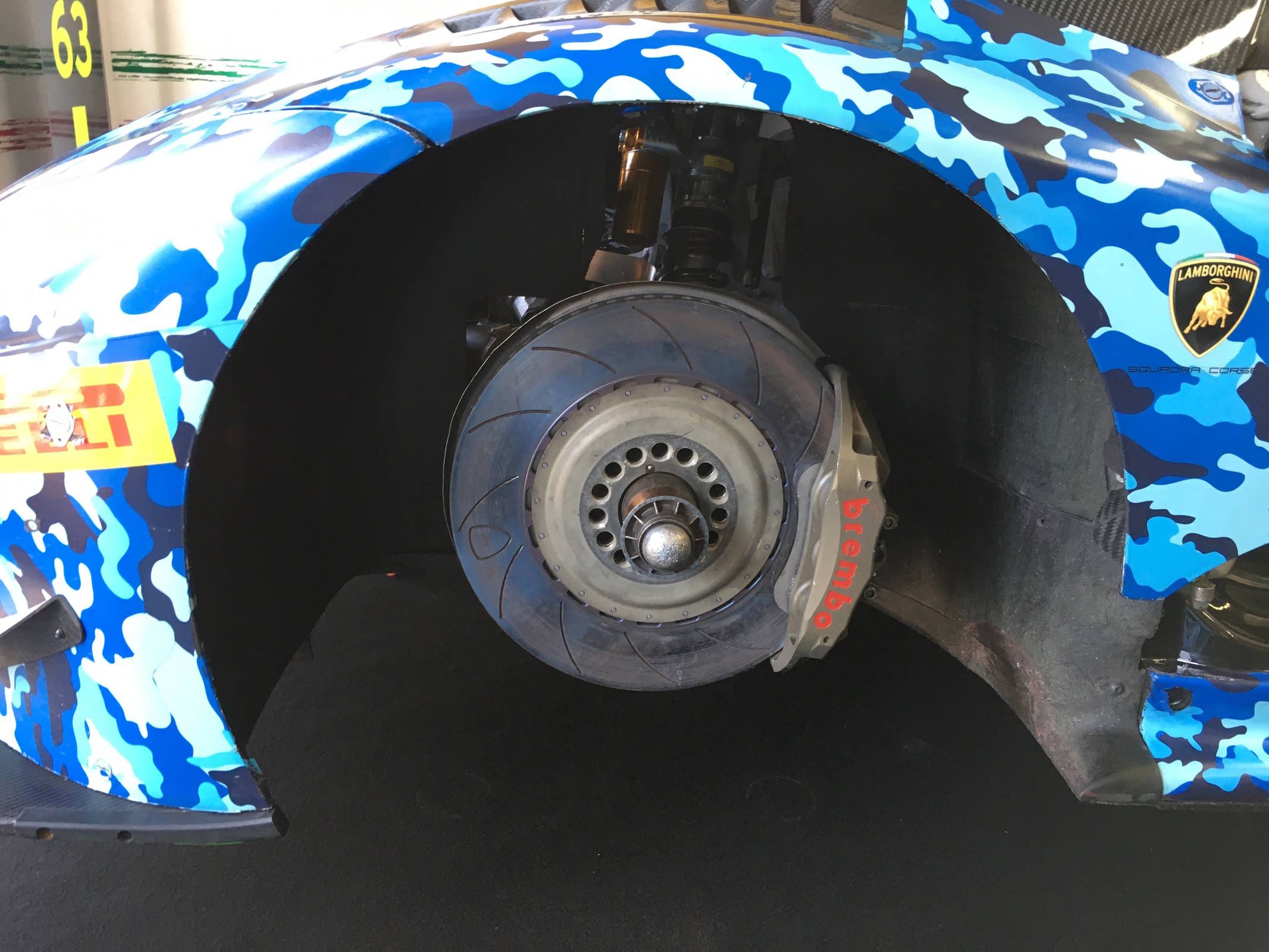 The front brake rotors are slotted and quite large. The Brembo calipers have six pistons.