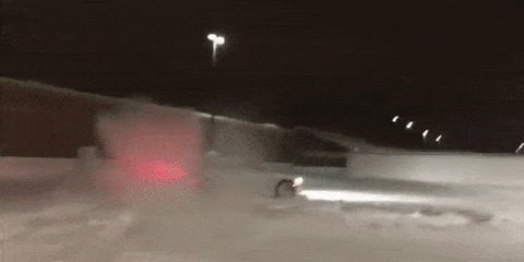 Watch this Dodge Charger Hellcat tear up an abandoned parking structure with a foot of snow on the ground.