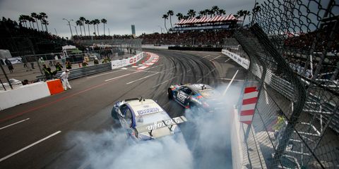 The rain, rain went away and Chelsea Denofa, foreground in the BMW, ruled the day. Here he is edging two-time champion Chris Forsberg's 370Z. Formula Drift started its 13th season stronger than ever on the streets of Long Beach On Saturday April 9.