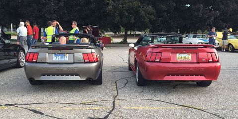 Two "New Edge" Ford Mustang convertibles.