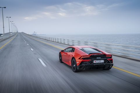 The 2020 Lamborghini Huracan Evo on the road with a new front bumper and "exposed" hexagonal mesh rear-end