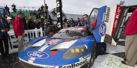 The Chip Ganassi Racing Ford GT raced by Joey Hand, Dirk Müller and Sébastien Bourdais is pushed into victory lane at Daytona Sunday.