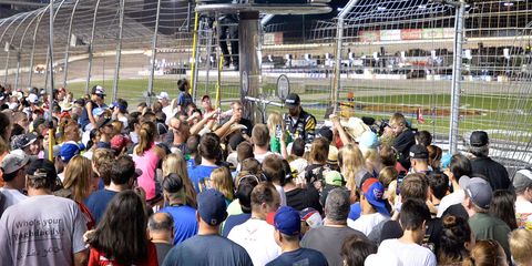 Many drivers, including James Hinchcliffe (above), turned Saturday night's rain delay into an autograph session.