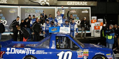 Tyler Reddick celebrates his season-opening NASCAR Camping World Truck Series win at Daytona International Speedway on Friday night.