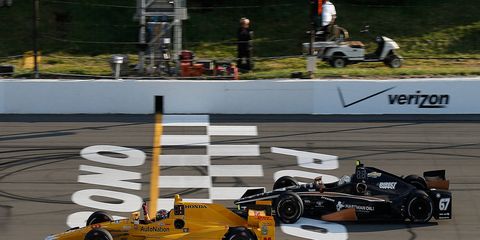 Ryan Hunter-Reay won a crash-marred Verizon IndyCar Series race at Pocono.