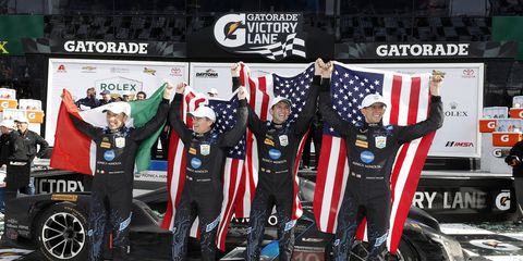 Ricky Taylor, Jordan Taylor, Max Angelelli, and Jeff Gordon celebrate in victory lane at Daytona Sunday.
