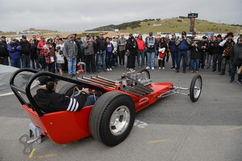 Don Prieto, owner and restorer, fires up the car, which was the first dragster for both TV Tommy Ivo and Don The Snake Prudhomme