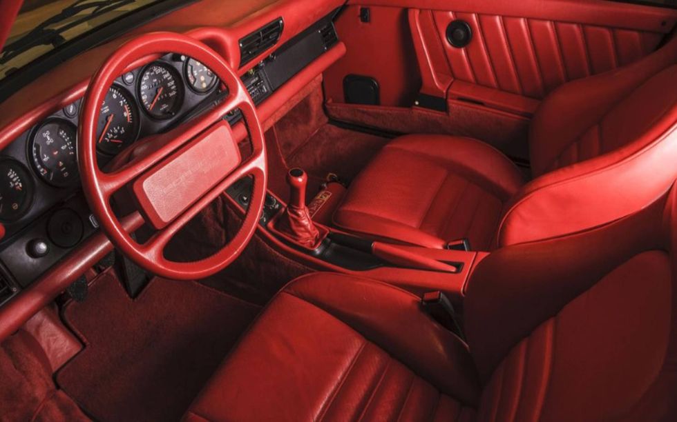 The 1988 Porsche 959 Komfort features a very red interior.