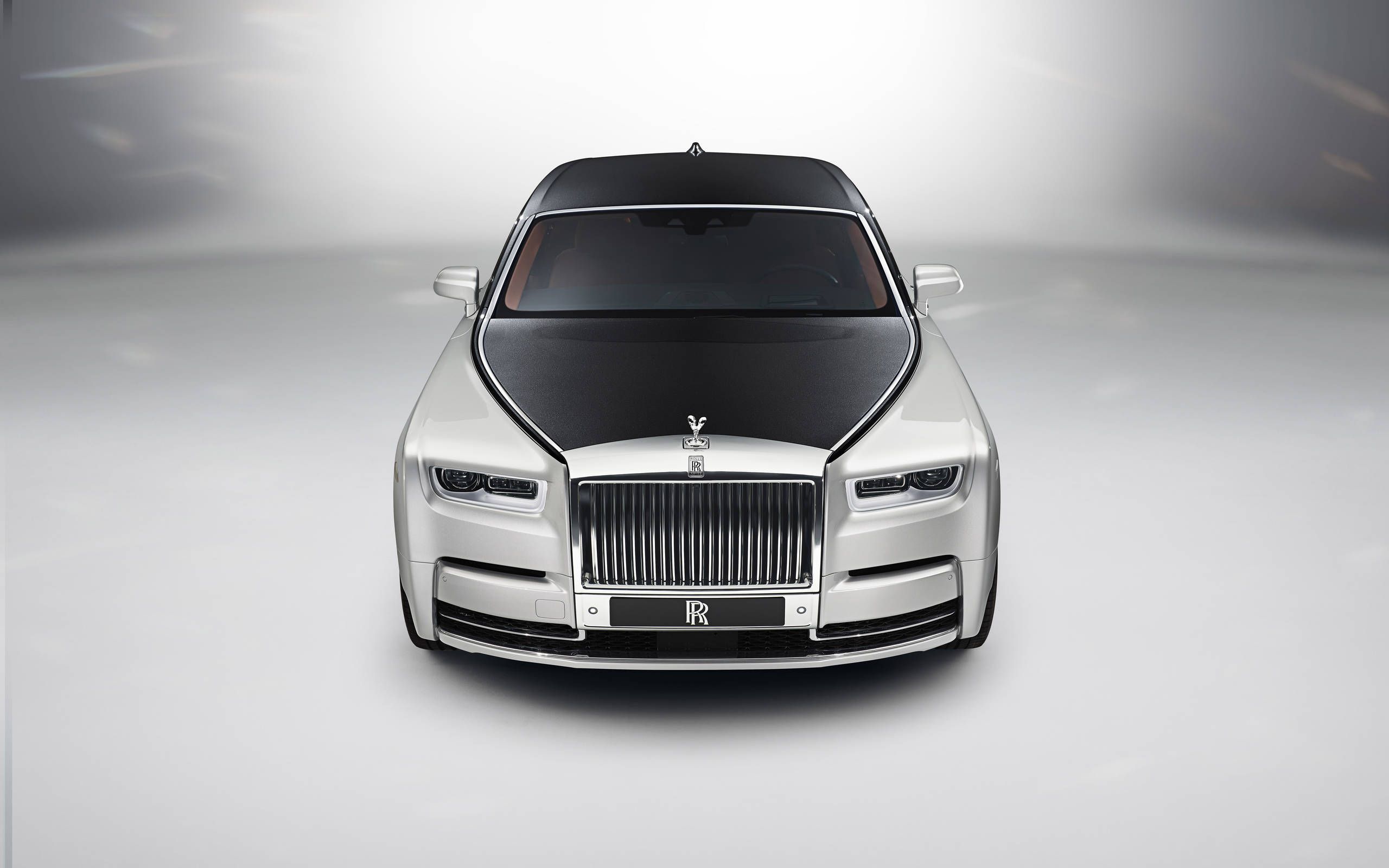 RollsRoyce Qatar on Instagram Guided by the light of its Illuminated  Grille Black Badge Ghost races through the shadows of Berlin with unbound  power and intensified