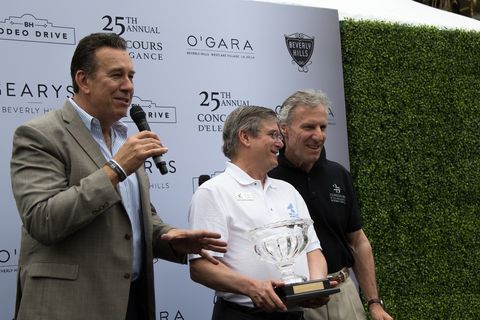 LA TV personality and event emcee Dave Kunz on left, Bruce Meyer at right and a lucky winner in center.
