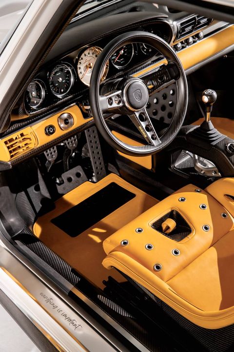 The 1990 Porsche 911 "reimagined by Singer" has a parallax white exterior and a Norfolk yellow interior.