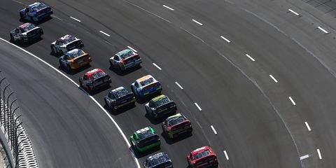 NASCAR Xfinity Series cars crowd the single lane entering Turn 1 Saturday at the newly repaved Texas Motor Speedway.