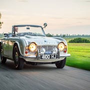 This restored TR4 police car is offered for sale, and can be used to (unofficially) pull over other British cars on classic tours.