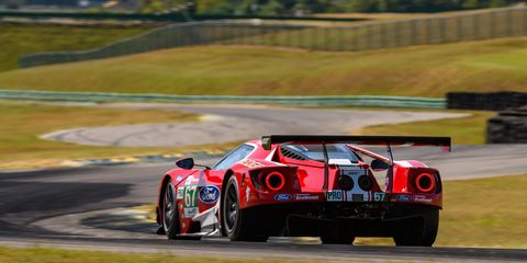 Tommy Kendall and racing journalists give the racing Ford GT for a final spin at Virginia International Raceway.

