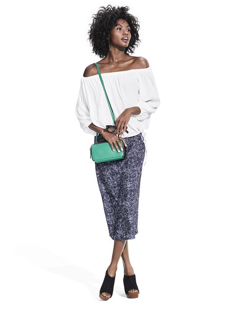 gathered white bardot top off the shoulder with printed skirt and green crossbody bag