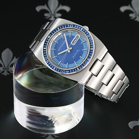 <p><strong><em>$675, <a href="http://gregoriades.com/product/1980s-wittnauer-longines-diver-automatic-21j-seiko-cal-7019/" target="_blank">gregoriades.com</a></em></strong></p><p>A list like this simply would not be complete without a funky and colorful vintage dive watch in the mix. Rather than folding entirely along with many other watch brands when quartz watches came onto the scene, Wittnauer was acquired by Seiko in Japan. This particular model is a great example of one of the early Seiko-powered Wittnauer watches, making it a great vintage buy for the money compared to older Swiss-made examples.</p>