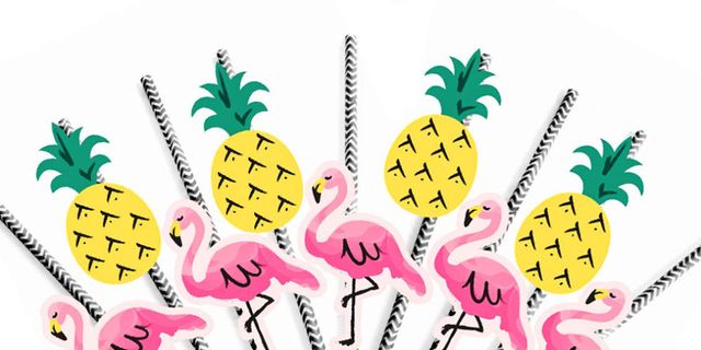 Single yellow drinking cocktail straw decorated with pink flamingo