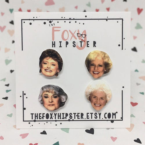 <p><strong data-redactor-tag="strong" data-verified="redactor"><em data-redactor-tag="em" data-verified="redactor">Golden Girls Studs by FoxyHipster<br>$16</em></strong> <a href="https://www.etsy.com/listing/226235737/the-golden-girls-inspired-stud-earrings?" target="_blank" class="slide-buy--button" data-tracking-id="recirc-text-link">BUY NOW</a></p><p>Split them up between friends or just wear them yourself.</p>