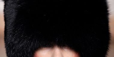 Lip, Chin, Fur clothing, Headgear, Hat, Natural material, Black hair, Costume accessory, Fashion, Animal product, 
