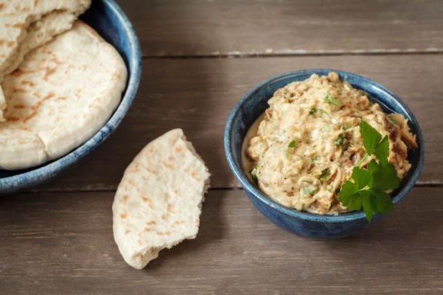 Bowl of Baba Ghanoush with flat bread