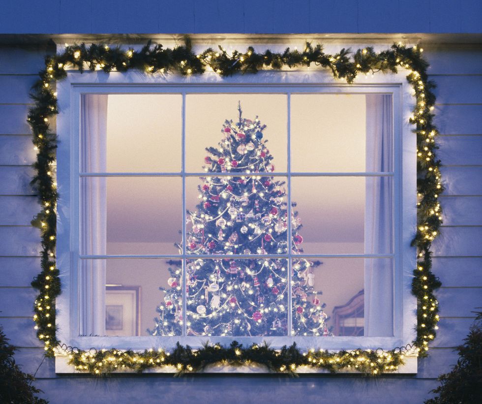 Christmas tree seen through house window