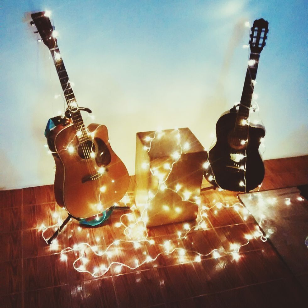 Guitars Covered With Illuminated Christmas Lights
