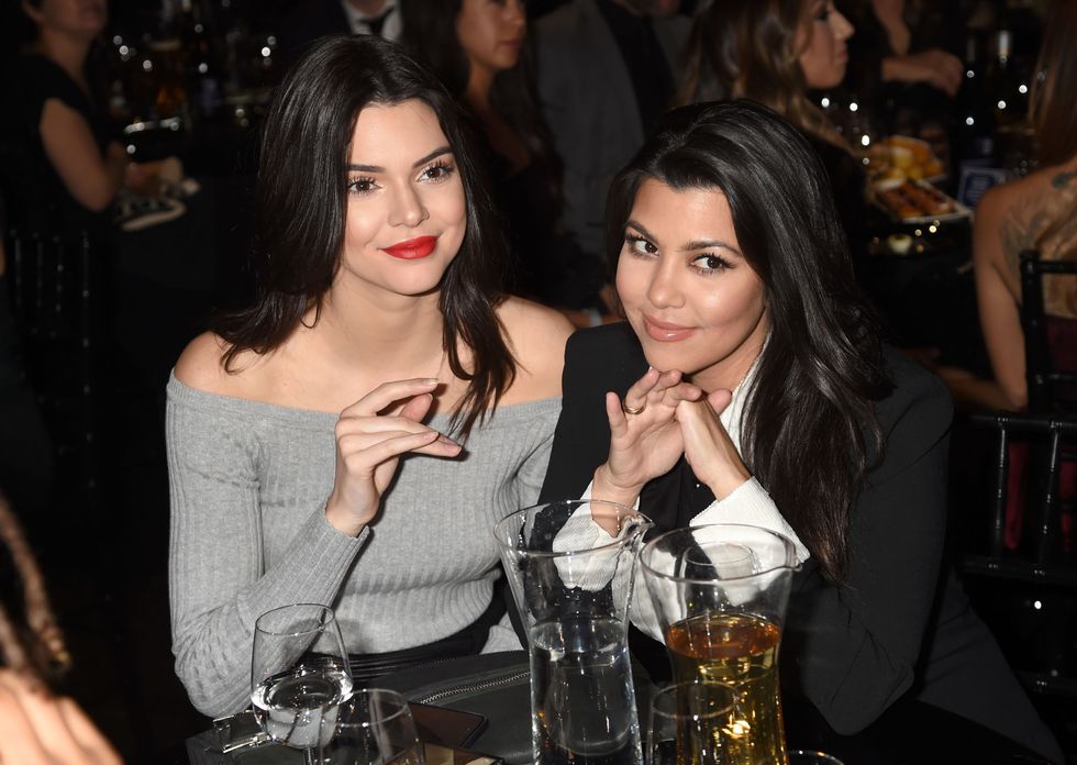 LOS ANGELES, CA - MARCH 14:  TV personalities Kendall Jenner (L) and Kourtney Kardashian attend The Comedy Central Roast of Justin Bieber at Sony Pictures Studios on March 14, 2015 in Los Angeles, California. The Comedy Central Roast of Justin Bieber will air on March 30, 2015 at 10:00 p.m. ET/PT.  (Photo by Jeff Kravitz/FilmMagic)