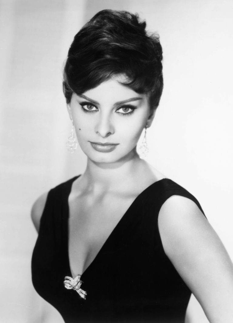 Sophia Loren, Italian actress, wearing a sleeveless top, with a plunging neckline, in a studio portrait, against a white background, circa 1950. (Photo by Silver Screen Collection/Getty Images)