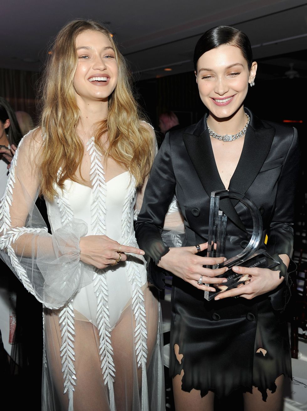 WEST HOLLYWOOD, CA - MARCH 20:  EXCLUSIVE COVERAGE Model Gigi Hadid (L) and Model of the Year award recipient Bella Hadid attend The Daily Front Row "Fashion Los Angeles Awards" 2016 at Sunset Tower Hotel on March 20, 2016 in West Hollywood, California.  (Photo by Donato Sardella/Getty Images for The Daily Front Row)