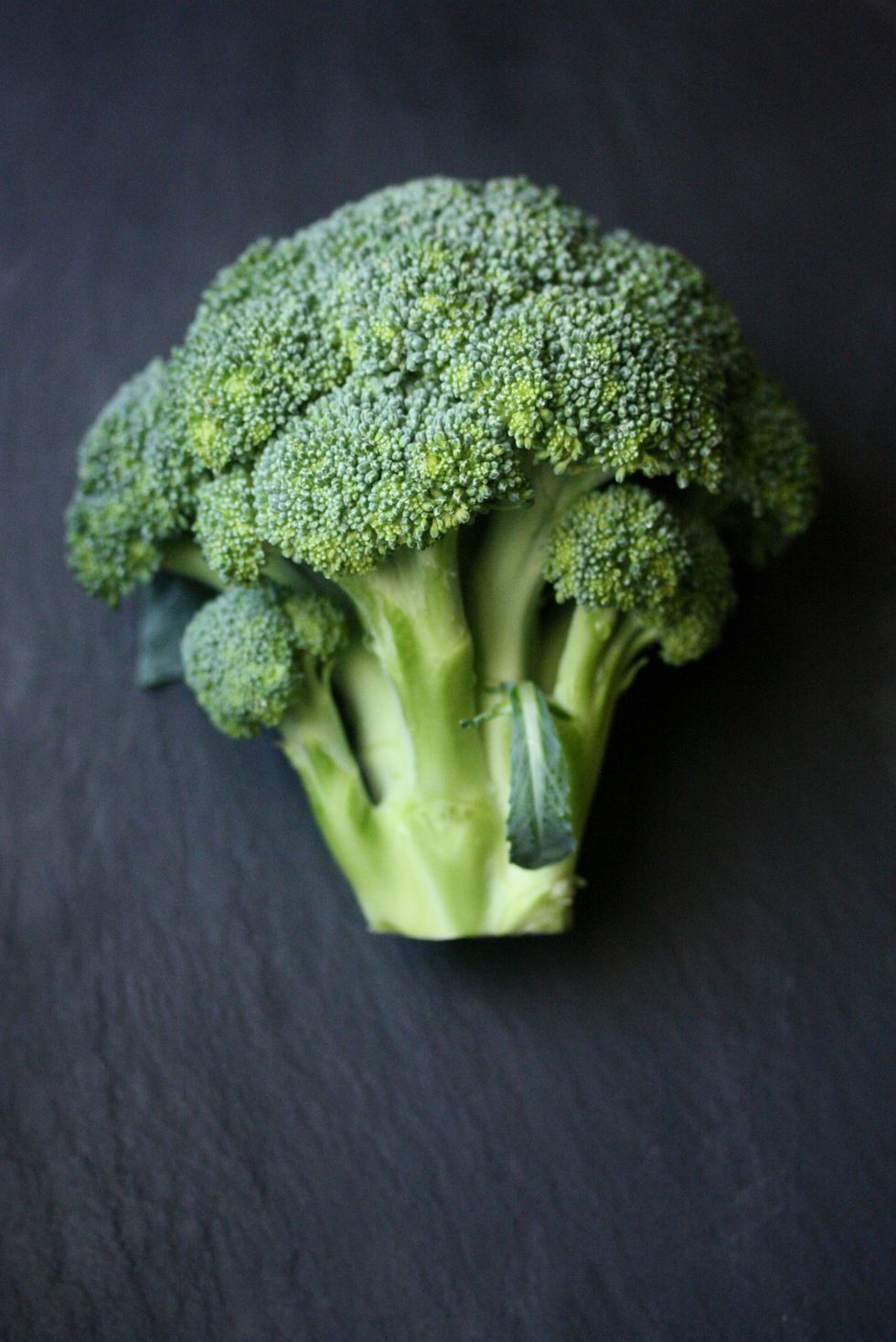 Fresh cut broccoli on table