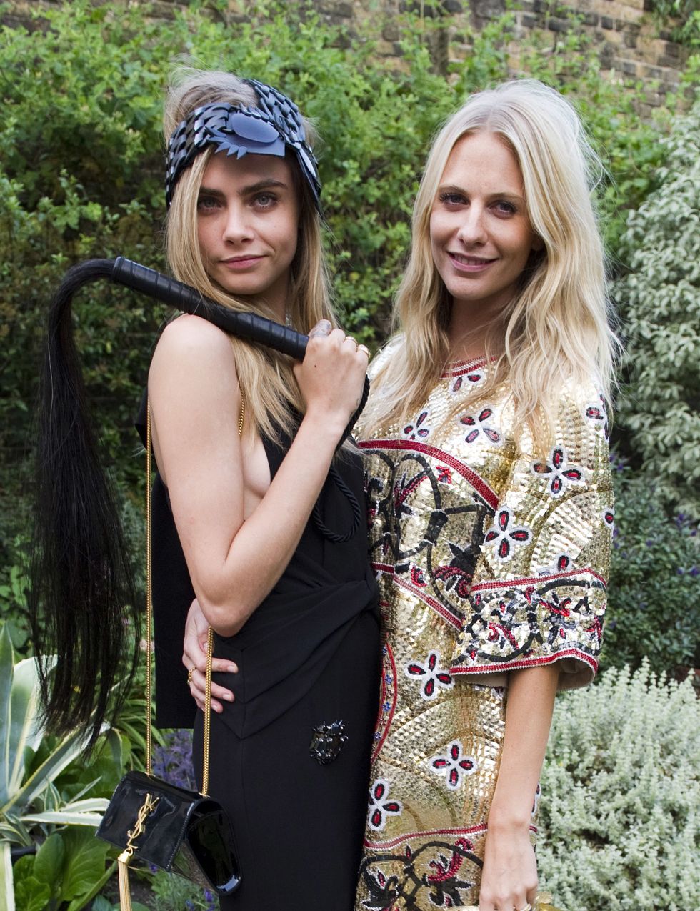 LONDON, UNITED KINGDOM - JULY 09: Cara Delevingne and Poppy Delevingne attend The Elephant Family presents "The Animal Ball" at Lancaster House on July 9, 2013 in London, England. (Photo by David M. Benett/Getty Images)