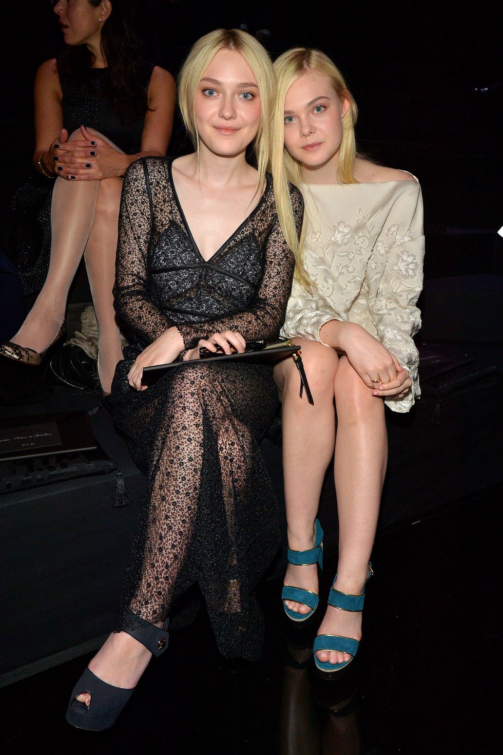 PARIS, FRANCE - OCTOBER 02: (L-R) Dakota Fanning and Elle Fanning attend the Louis Vuitton show as part of the Paris Fashion Week Womenswear  Spring/Summer 2014 on October 2, 2013 in Paris, France.  (Photo by Dominique Charriau/WireImage)