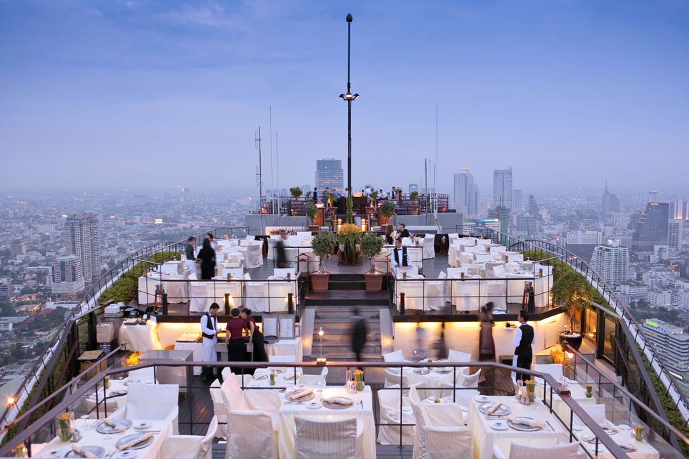 South East Asia, Thailand, Bangkok, Sathorn district, Banyan Tree, dining at the Vertigo restaurant overlooking metropolitan Bangkok