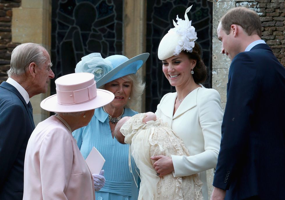 KING'S LYNN, ENGLAND - JULY 05:  Catherine, Duchess of Cambridge, Prince William, Duke of Cambridge, Princess Charlotte of Cambridge and Prince George of Cambridge talk to Queen Elizabeth II, Prince Phillip, Duke of Cambridge and Camilla, Duchess of Cornwall as they arrive at the Church of St Mary Magdalene on the Sandringham Estate for the Christening of Princess Charlotte of Cambridge on July 5, 2015 in King's Lynn, England.  (Photo by Chris Jackson/Getty Images)