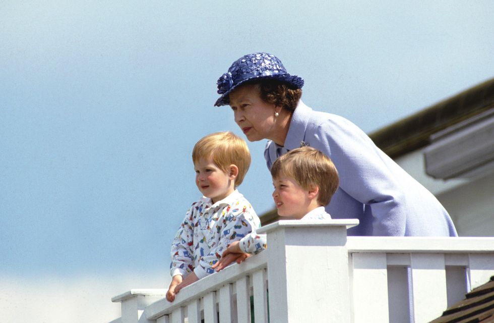 UNITED KINGDOM - JUNE 14:  The Queen With Prince William And Prince Harry In The Royal Box At Guards Polo Club, Smiths Lawn, Windsor  (Photo by Tim Graham/Getty Images)