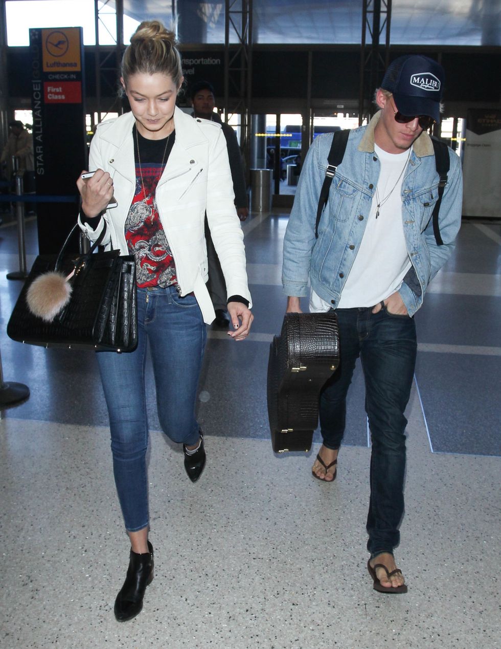 LOS ANGELES, CA - DECEMBER 27: Cody Simpson and Gigi Hadid are seen at LAX on December 27, 2014 in Los Angeles, California.  (Photo by GVK/Bauer-Griffin/GC Images)